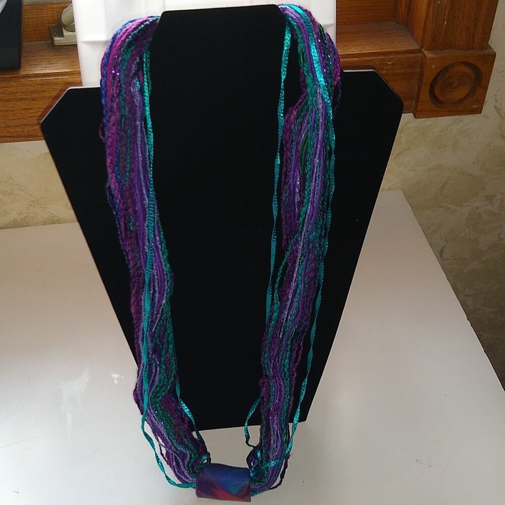Colorful string necklace. And blues purples turquoise.